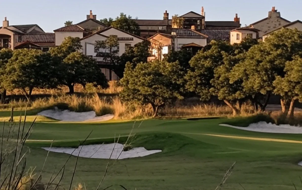 The Clubs of Cordillera Ranch in Texas view of golf course with housing in background via Grok