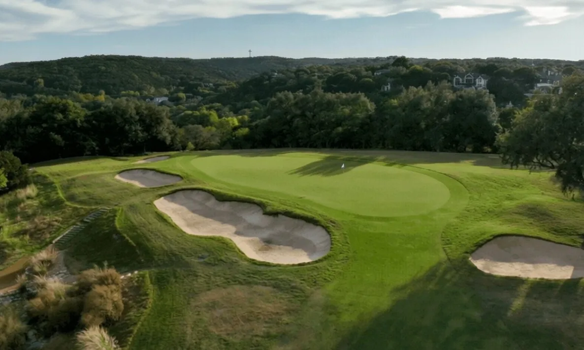 Barton Creek Country Club in Austin, Texas view of green with bunkers and flagstick
