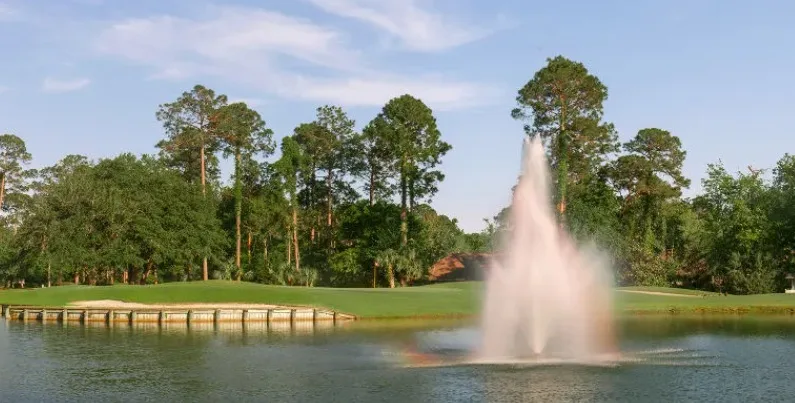 Osprey Cove in St. Marys, Georgia view of green surrounded by water with fountain
